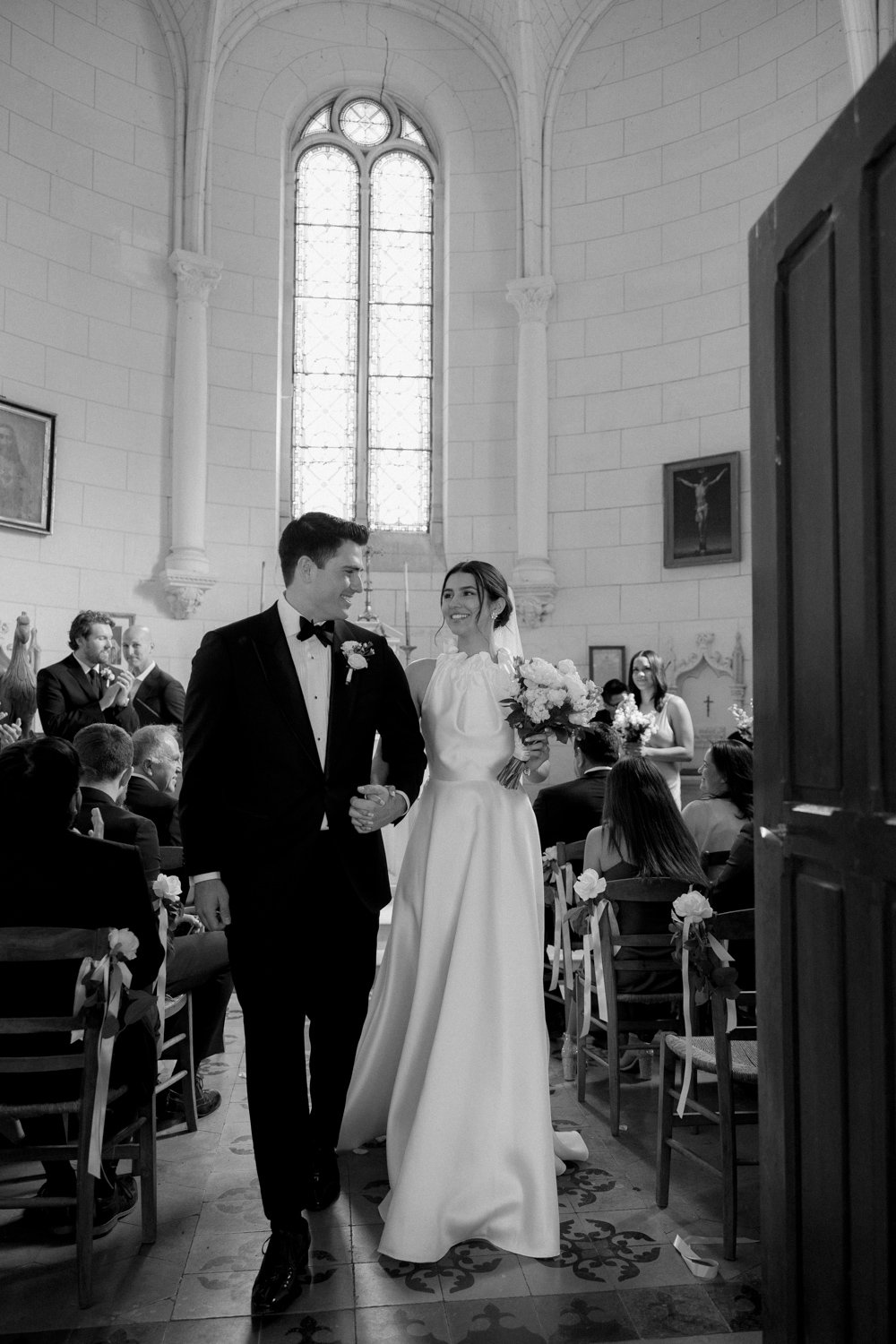 chateau wedding photographer chapel ceremony paris couple exit