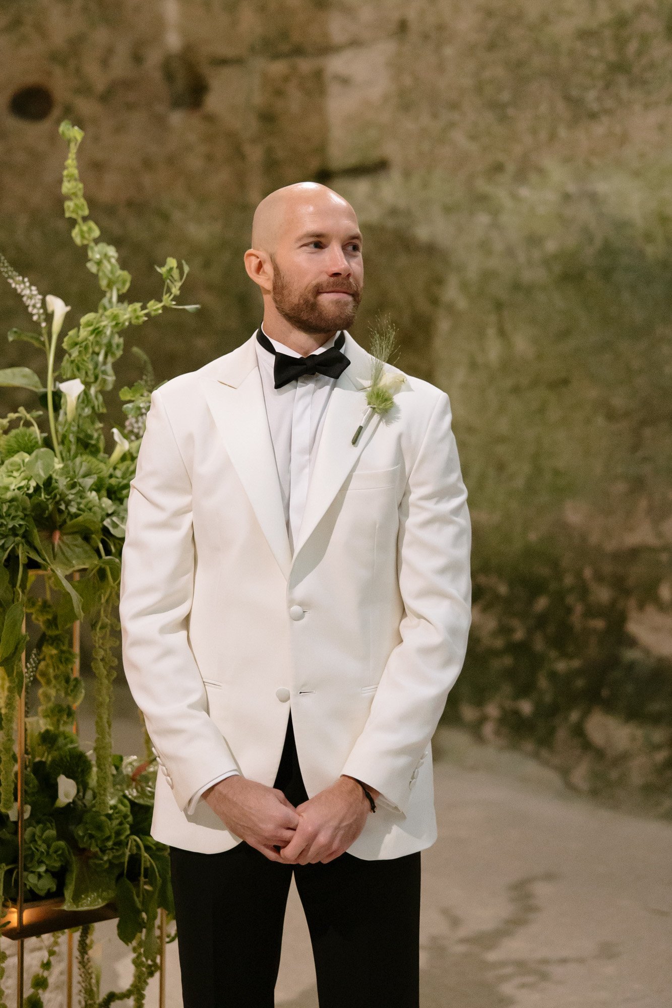 A man in a white suit.