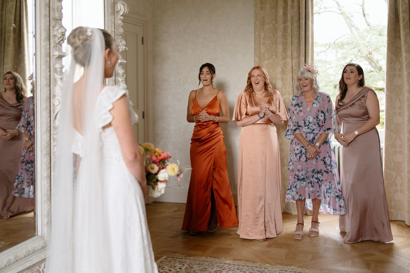 A group of women in dresses. Autumn France wedding.