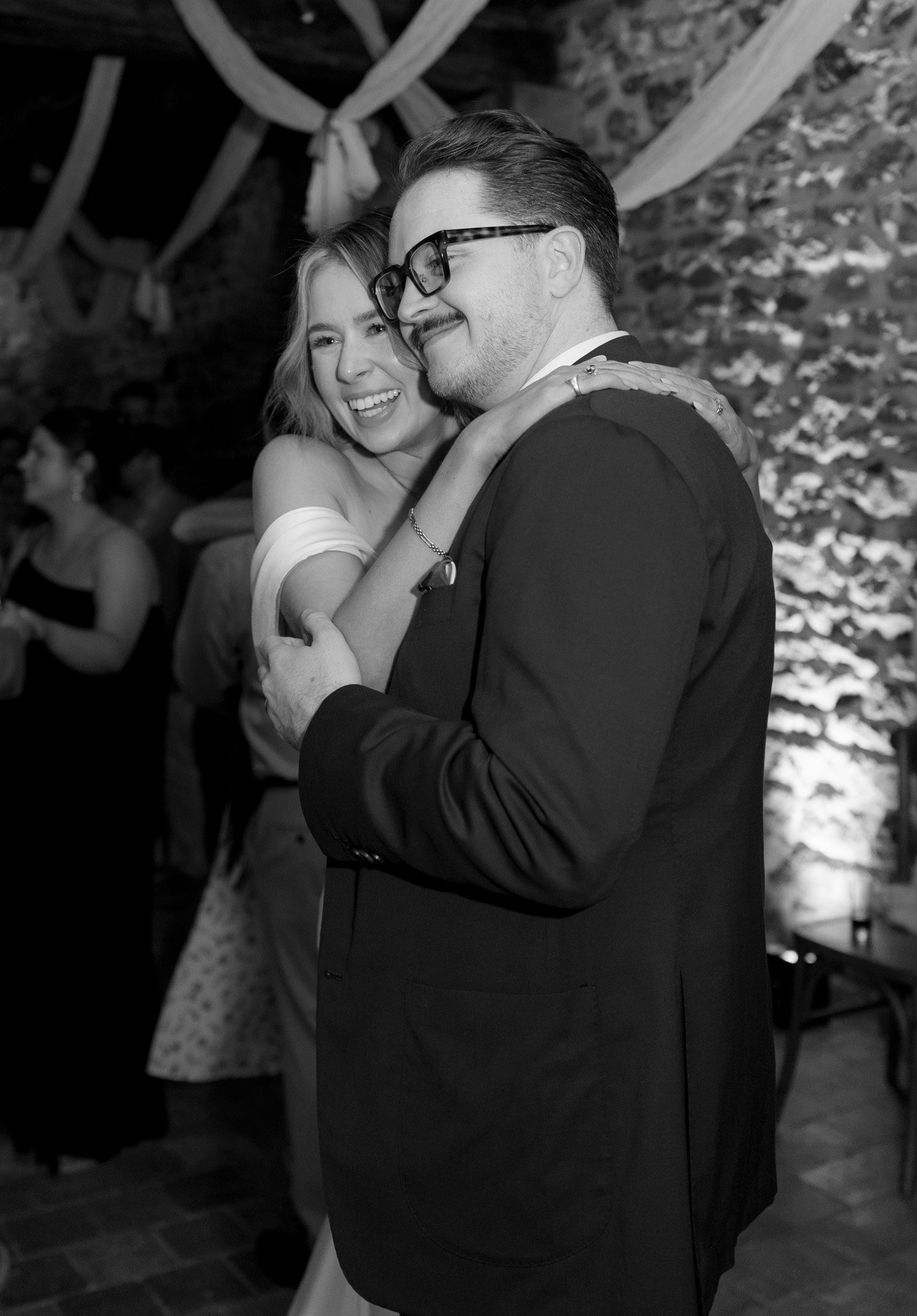 A man and woman hugging.