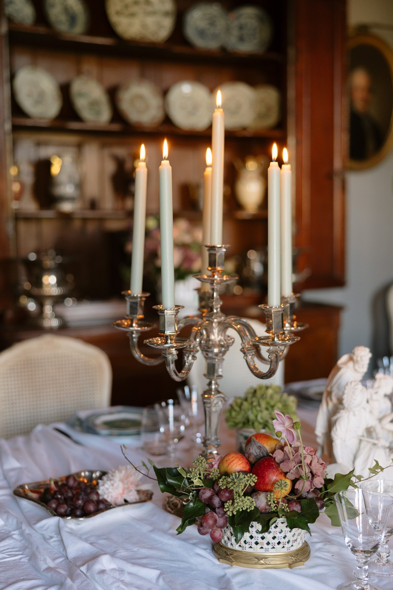 A candelabra with candles on a table.