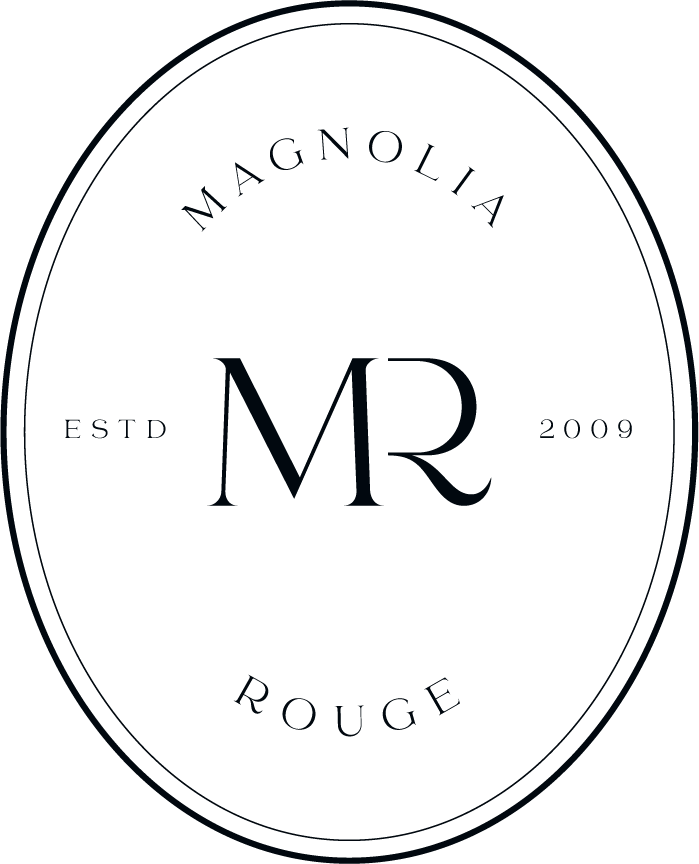Oval logo with the letters MR in the centre, surrounded by the words Magnolia Rouge and EST 2009 on a light background.